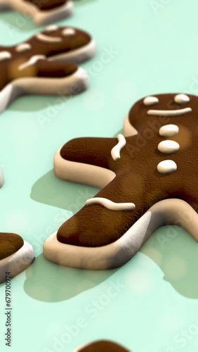 Gingerbread Cookies on a Light  Green background pattern. Vertical Video.