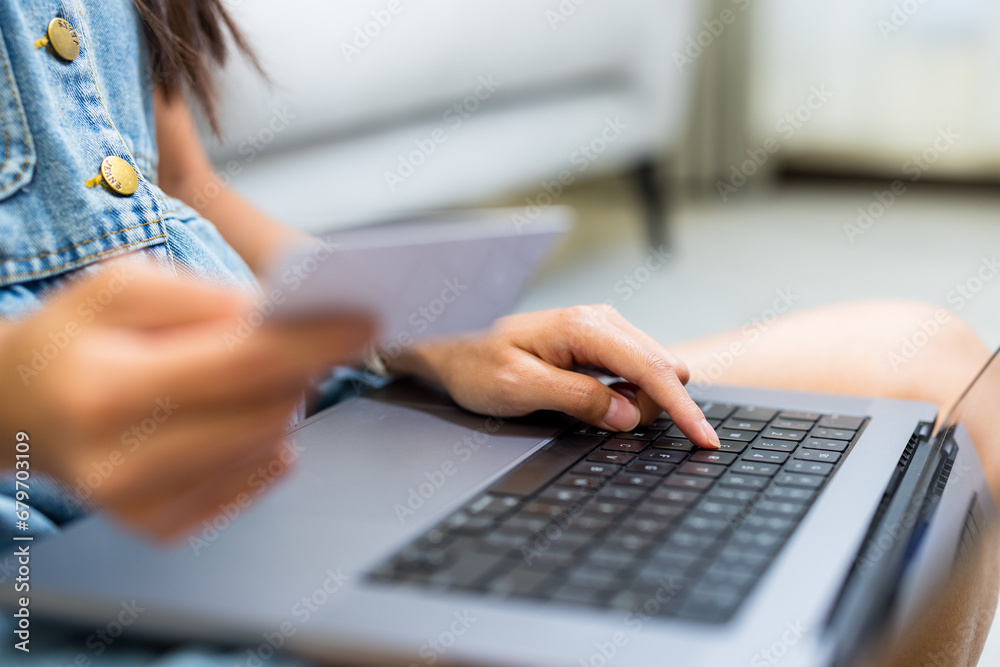 Woman use laptop computer for shopping online with credit card at home Woman use laptop computer for shopping online with credit card at home