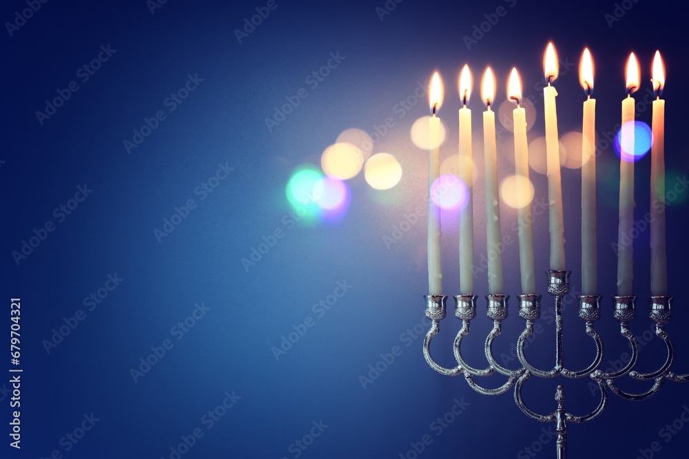 Religion image of jewish holiday Hanukkah background with menorah (traditional candelabra) and candles Religion image of jewish holiday Hanukkah background with menorah (traditional candelabra) and candles