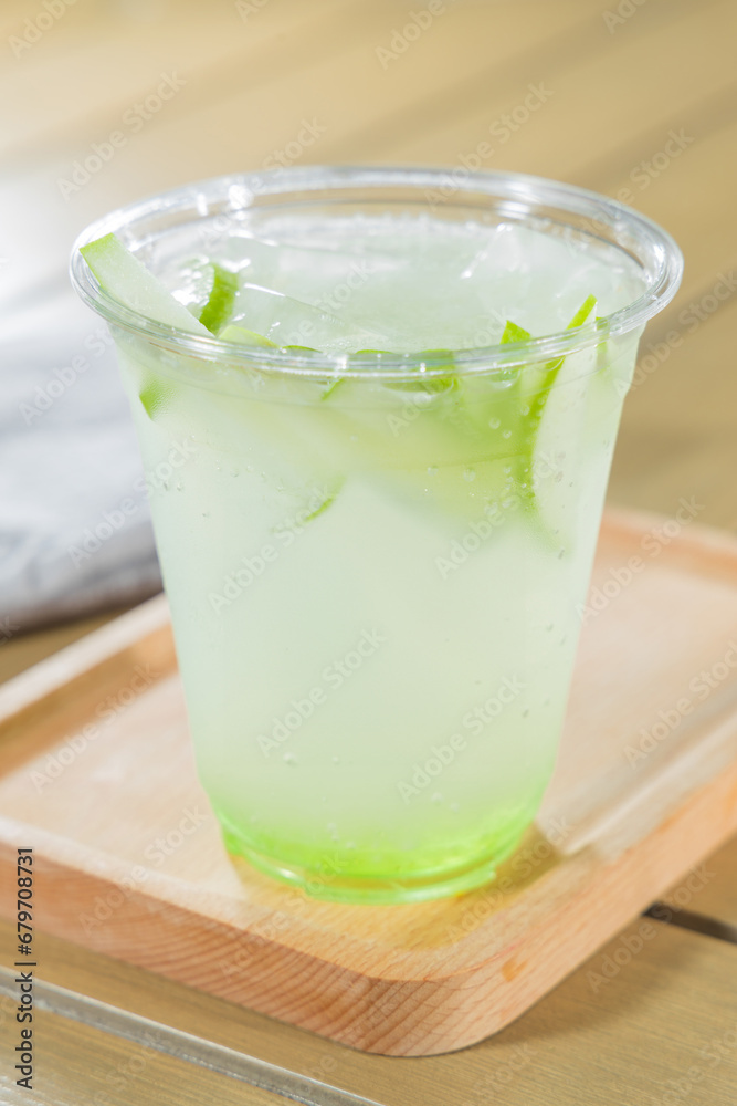 iced green tea with lime on wood table - soft focus with vintage film filter iced green tea with lime on wood table - soft focus with vintage film filter