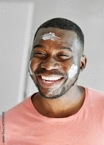 man bathroom beauty portrait hygiene morning care skin cream face routine skincare clean cosmetic applying young moisturizer beard healthy facial