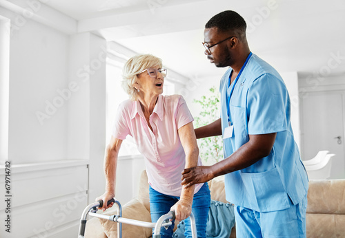 nurse doctor senior care caregiver help walker assistence retirement home nursing elderly woman black man hospital clinic home disability disabled photo