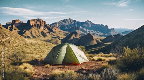 Backcountry Tent Camping in Big Bend National Park, Texas - Ultralight Hiking Gear Tarp Tent Campsite with Prickly Peak Cactus, Chisos Mountains Landscape Background photo