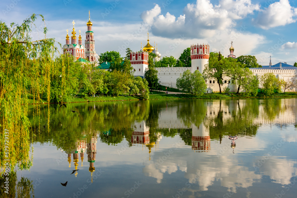 Novodevichy Convent (New maiden's monastery) reflected in pond, Moscow, Russia Novodevichy Convent (New maiden's monastery) reflected in pond, Moscow, Russia