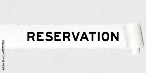 Ripped gray paper background that have word reservation under torn part