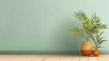 Une plante verte avec des feuilles allongées dans un pot en terre cuite, posée sur un sol en bois contre un mur vert.