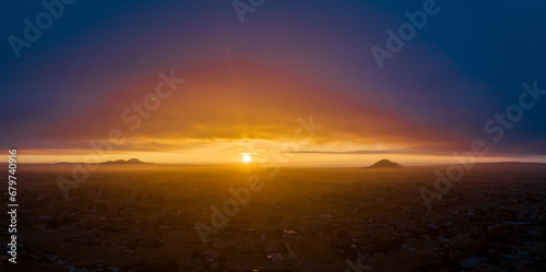 Brilliantly colorful sunset over California City in the Mojave Desert - aerial