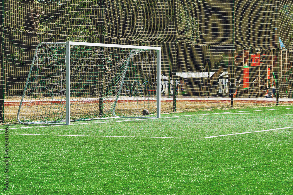 Fototapeta premium soccer gates. Football goal at the stadium. Football field with artificial lawn. Concept other party of soccer. At stadium.