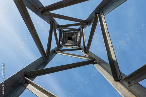 Fotografie Looking up inside the metal structure of an antique electric pole