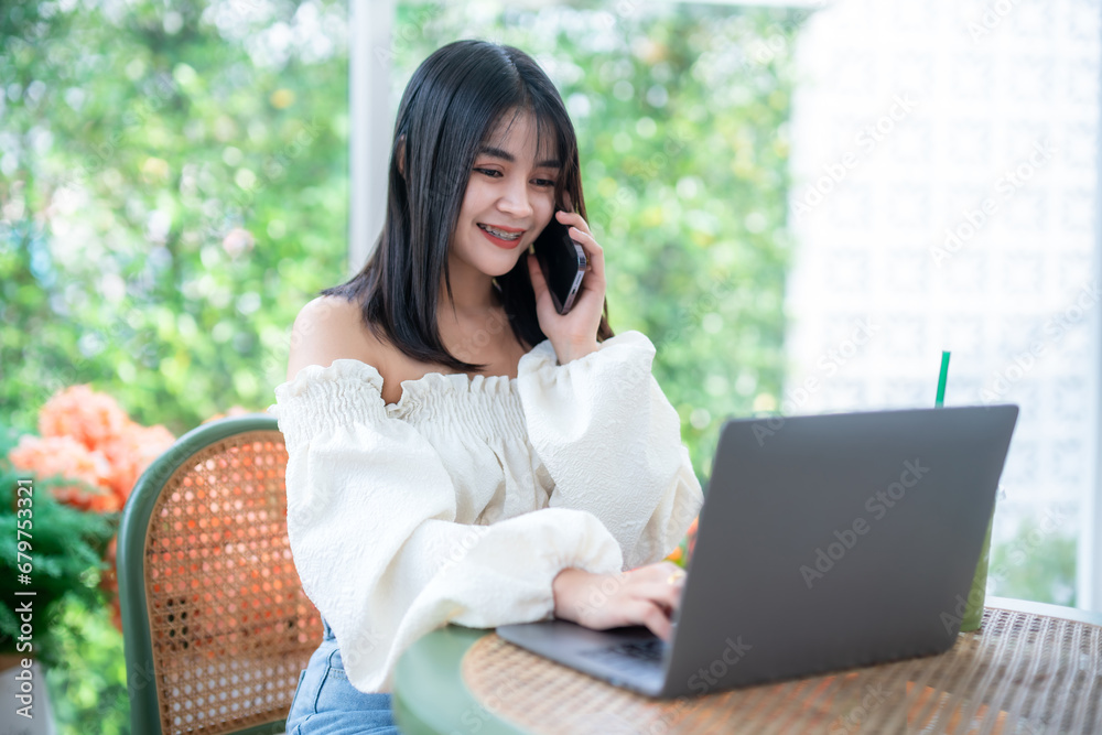 Happy of asian freelance people business female talking making using smartphone casual working with laptop computer and coffee cup in at the cafe, Business Lifestyle communication concept Happy of asian freelance people business female talking making using smartphone casual working with laptop computer and coffee cup in at the cafe, Business Lifestyle communication concept