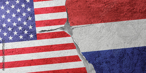 USA and Netherlands flags on a stone wall with a crack, illustration of the concept of a global crisis in political and economic relations