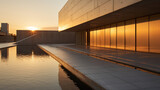 bâtiment moderne d'architecte contemporain avec de larges baies vitrées, structure à base de béton brut et de ligne pure, photo à l'heure dorée