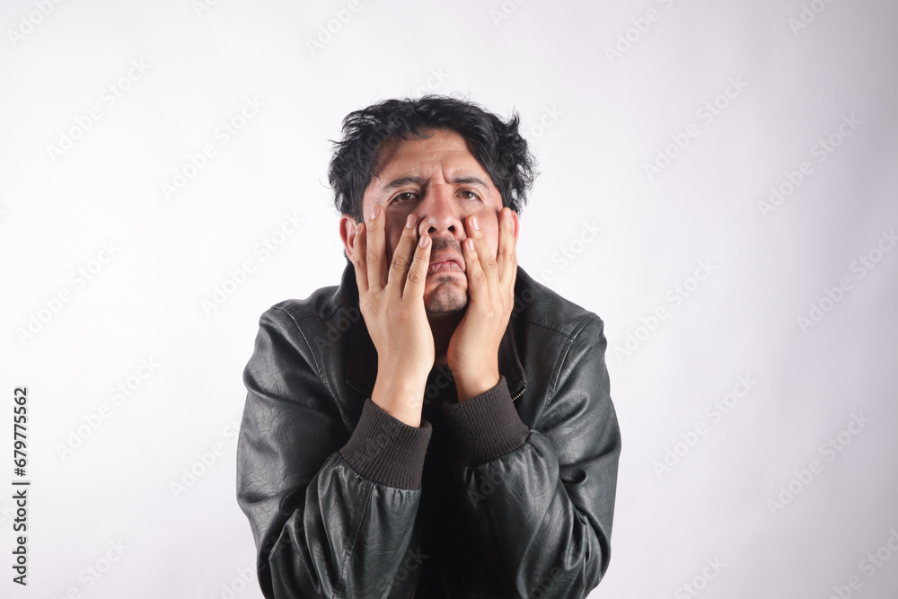 Photograph of person holding his head very annoying. Concept of emotions and stress. Photograph of person holding his head very annoying. Concept of emotions and stress.