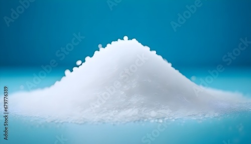 White sea salt on a blue background, fresh salt extracted from sea water