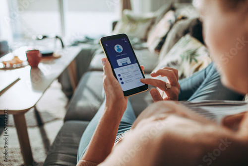 Woman Managing Finances on Banking App with Smartphone photo