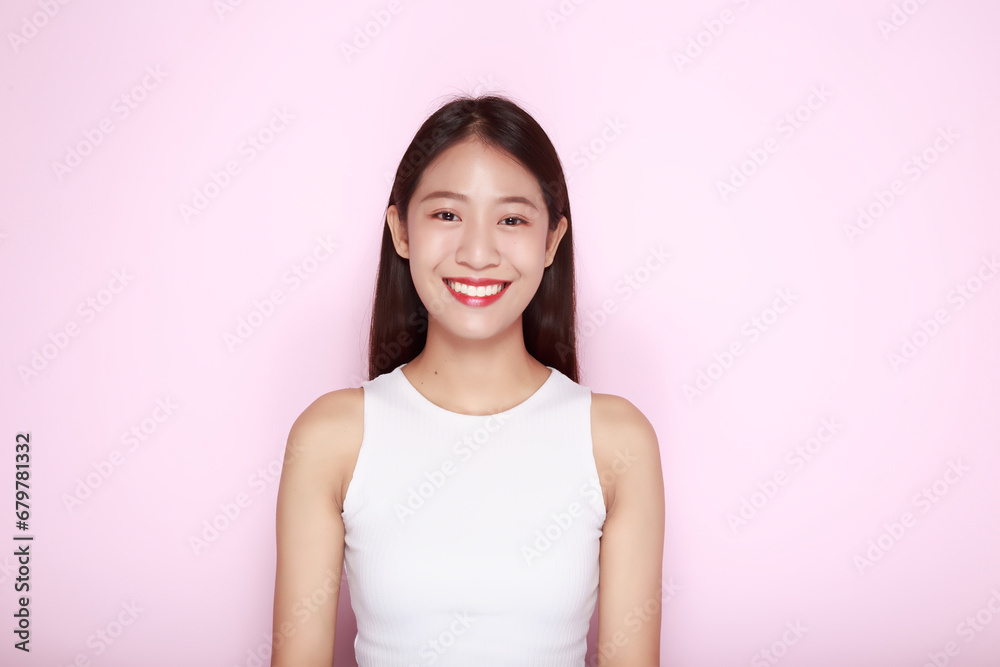 Beautiful girl smiling happily, Portrait of a beautiful young woman in a light pink background, happy and smile, posting in stand position. Beautiful girl smiling happily, Portrait of a beautiful young woman in a light pink background, happy and smile, posting in stand position.
