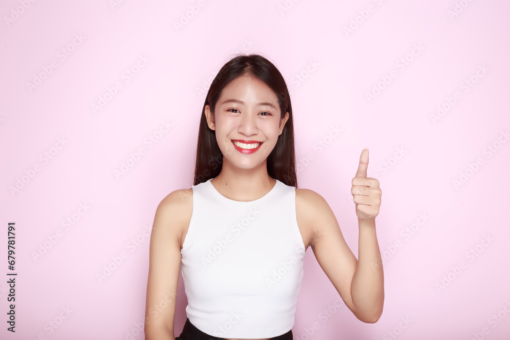 Asian woman giving two thumbs up, Portrait of a friendly young woman smiling happily, Portrait of a beautiful young woman in a light pink background, Asian woman giving two thumbs up, Portrait of a friendly young woman smiling happily, Portrait of a beautiful young woman in a light pink background,