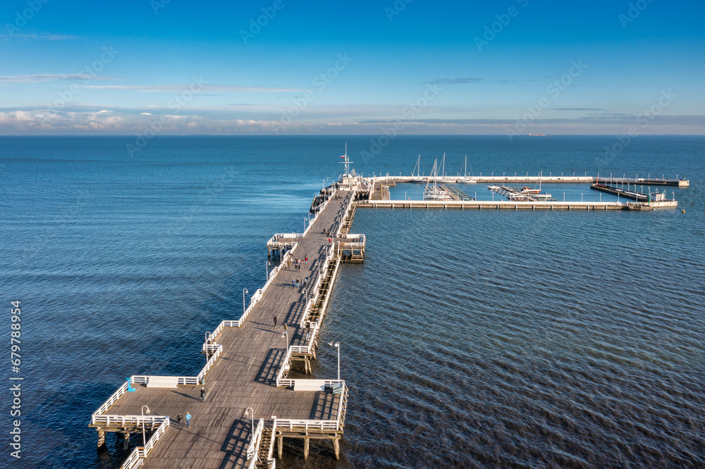 Aerial view of the Baltic sea coastline and wooden pier in Sopot at autumn, Poland