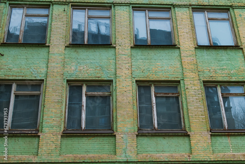 The green brick building of the old school. .