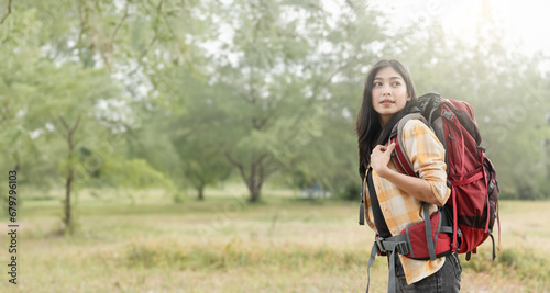 Billede på lærred Asian woman embracing nature, Conservation Tourism in Action