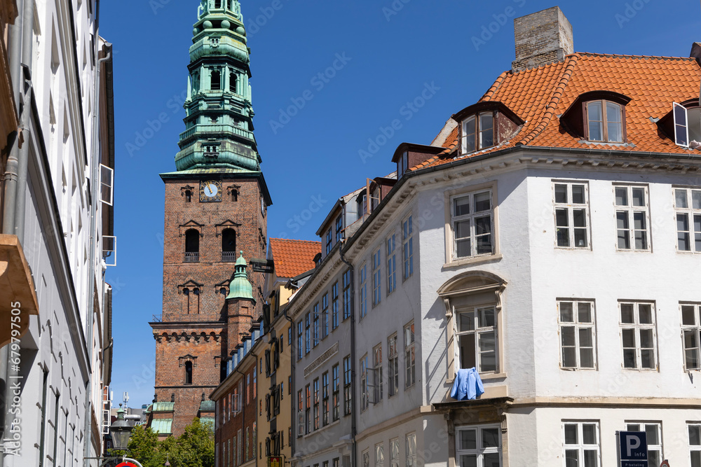 Downtown Copenhagen with old houses and church.