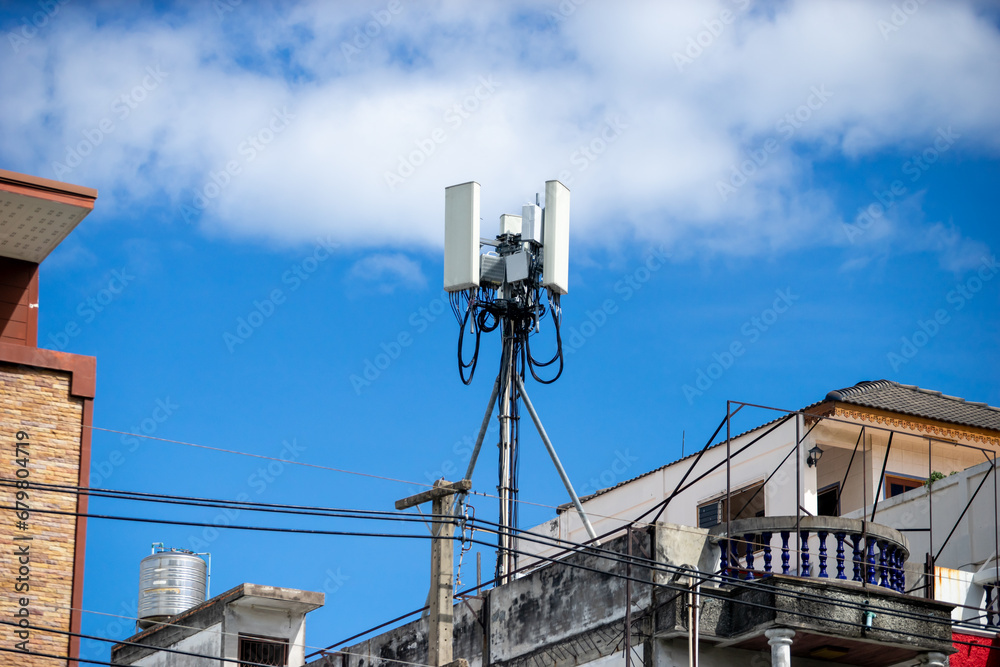 Telecommunication tower with blue sky and white clouds, technology background. Telecommunication tower with blue sky and white clouds, technology background.