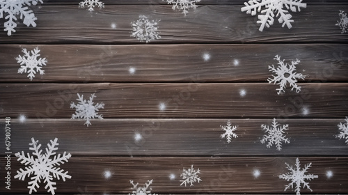 Snowflakes on wooden background. Christmas background. Top view.