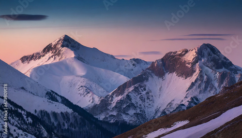 Bright sunrise in the snow covered mountains.