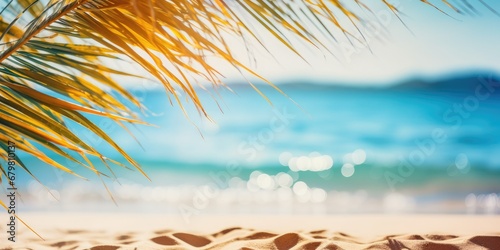 Summer landscape, nature of tropical golden beach and leaf palm, soft focus. Golden sand beach with glare in water, turquoise sea water, blue sky, white clouds. Copy space, summer vacation concept 