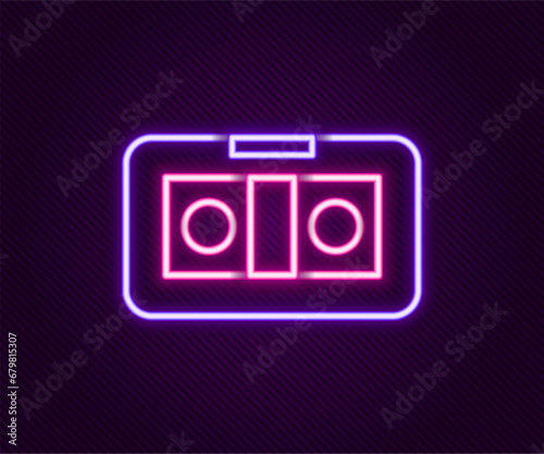 Glowing neon line VHS video cassette tape icon isolated on black background. Colorful outline concept. Vector