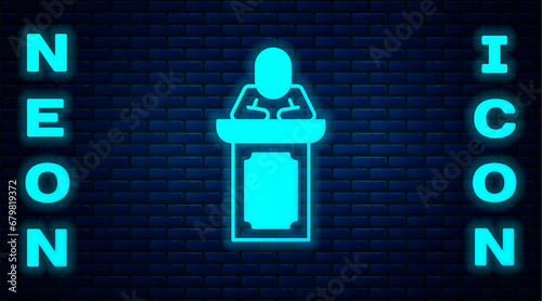Glowing neon Auction auctioneer sells icon isolated on brick wall background. Auction business, bid and sale. Vector