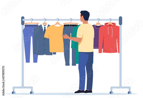 Clothes hang on a hanger. Fashion boutique, assortment showroom. Man stands in front of clothes rack and chooses clothes. Trousers, hoodie, jacket, t-shirt on hangers. Vector illustration.