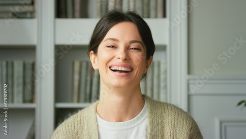 Portrait of a beautiful smiling confident young woman posing alone at home in office. European woman standing indoor smiling looking at camera. Happy casual lady with pretty face. Close up Free Download Portrait of a beautiful smiling confident young woman posing alone at home in office. European woman standing indoor smiling looking at camera. Happy casual lady with pretty face. Close up - GFXLoad