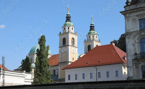 bell towers with a dome with copper roofing of Church St. Nicholas of the city of Ljubljana the capital of Slovenia in central Europe photo