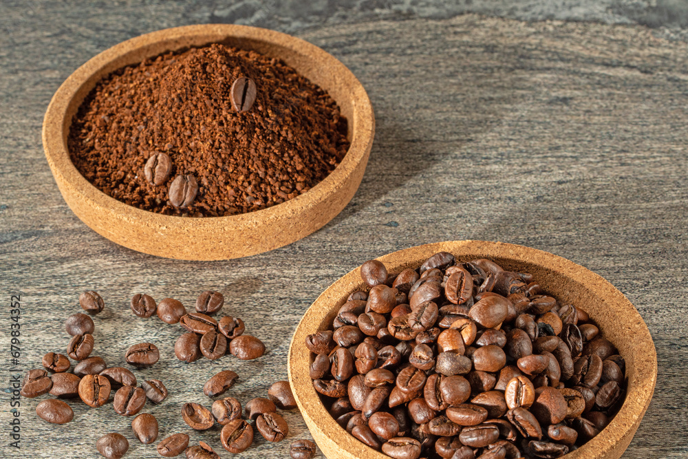 Coffee theme. Cork saucers filled with coffee beans and ground coffee granules Coffee theme. Cork saucers filled with coffee beans and ground coffee granules