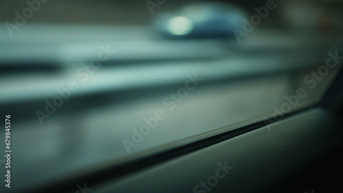 Backseat of car passenger POV staring at window driving through highway road, dreamlike scene photo