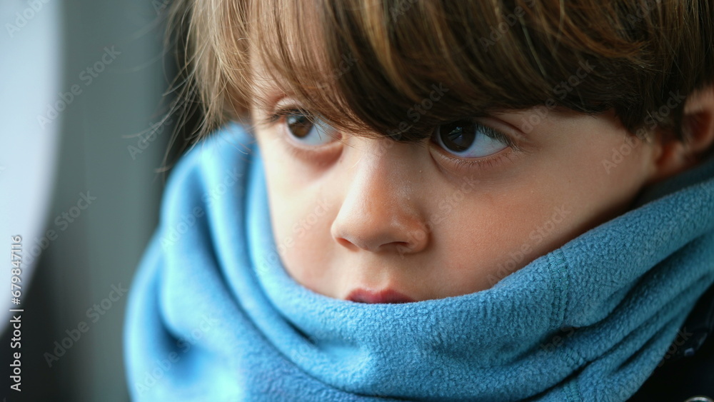 Close-up of a contemplative young caucasian boy, ensconced in a scarf, reflecting a depth of introspection, encapsulating a profound meditative state Close-up of a contemplative young caucasian boy, ensconced in a scarf, reflecting a depth of introspection, encapsulating a profound meditative state