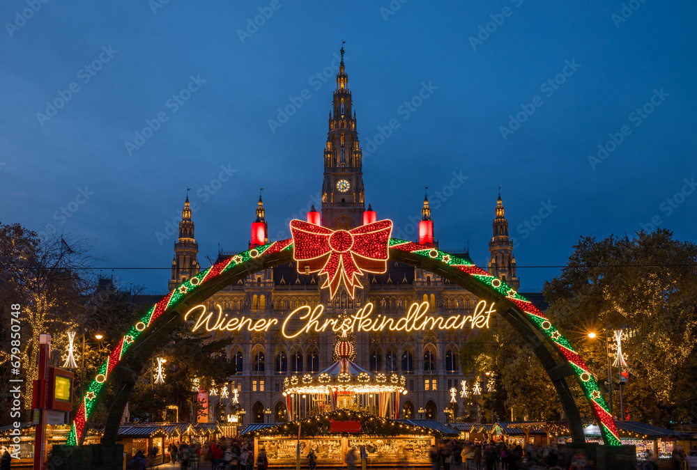 Decorations (translation: Viennese Christmas market ) of Christmas market in Rathaus park with City Hall in the center - Vienna, Austria