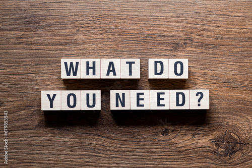 Obraz na plátne What do you need - word concept on building blocks, text