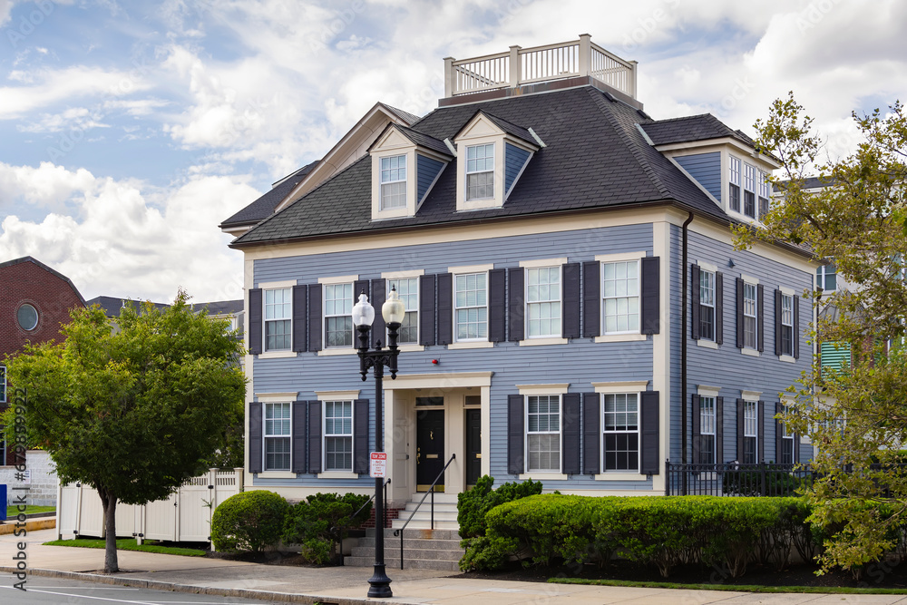 Beautiful multi-family house exterior view on a cloudy summer day in Boston, Massachusetts, USA