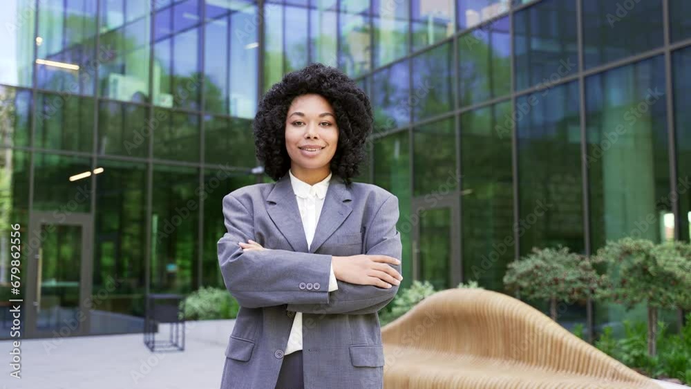 Portrait of a young happy african american businesswoman in a suit ...