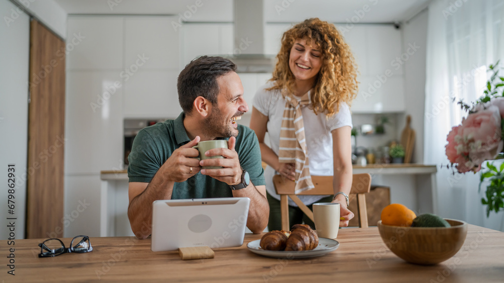 happy couple man and woman husband and wife morning routine use tablet - obrazy, fototapety, plakaty 
