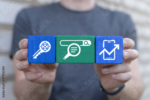 Man holding colorful blocks sees word: DOWNLOAD. Concept of Download Data Storage Business Web Technology. Downloading.