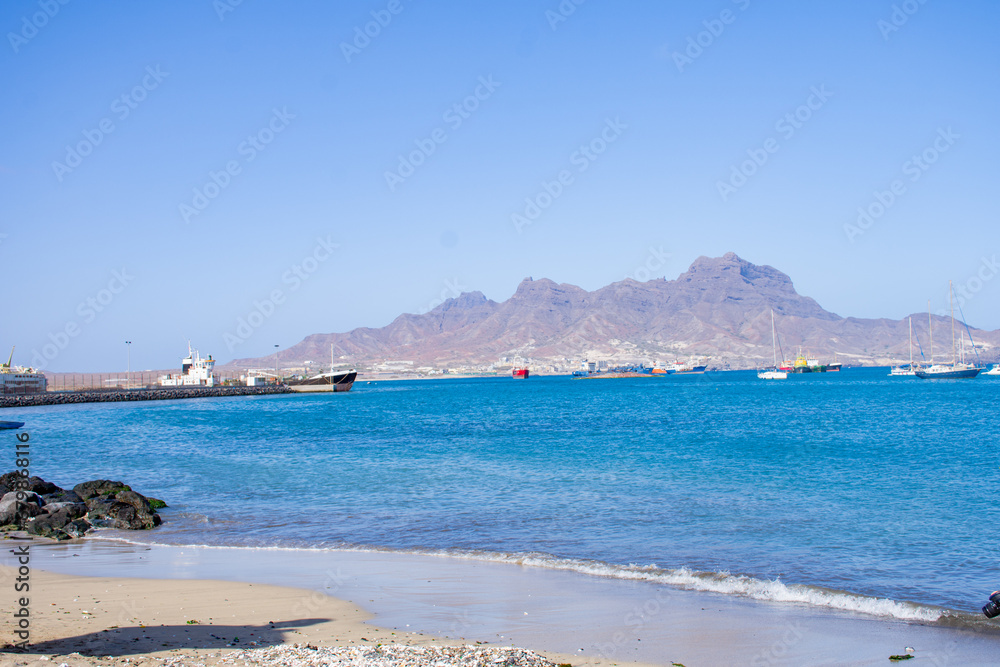 Landscape View of Laginha beach and small boat in Mindelo city in Sao Vicente Island in Cape Verde