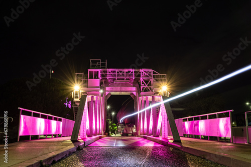 gabut lift bridge at La Rochelle. night shot with pink lights for pink october. Pink October is breast cancer awareness month photo