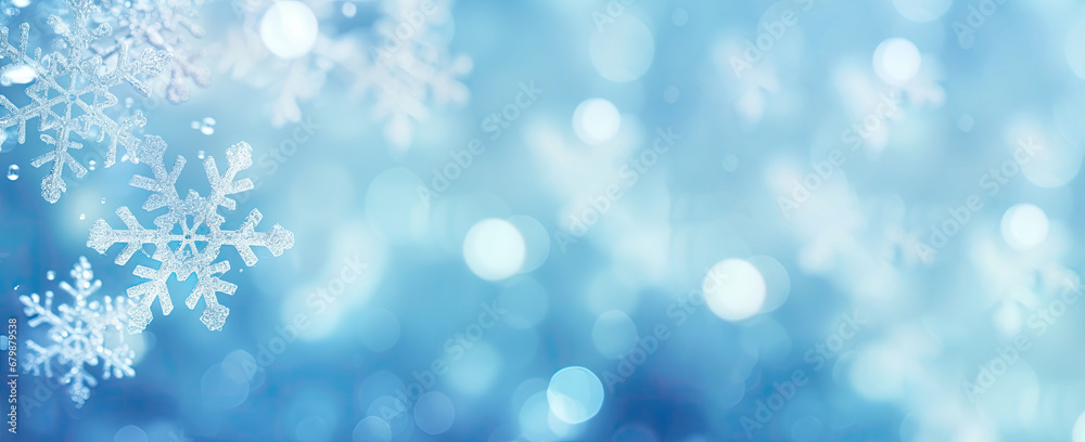 Snowflakes on blue bokeh background. Christmas and New Year concept
