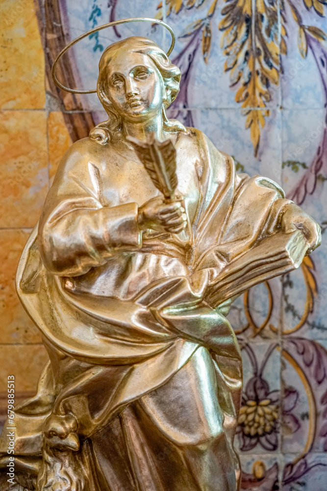 small golden statue representing saint john present in the church of santo antonio in lisbon. small golden statue representing saint john present in the church of santo antonio in lisbon.
