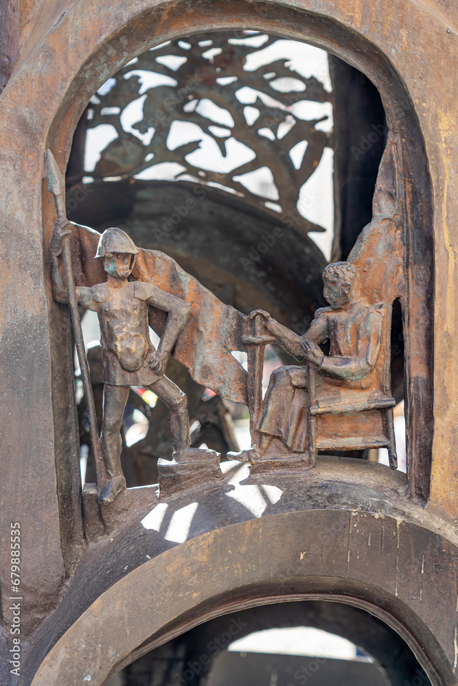 Details of figures at the base of the metal statue in homage to Santo Antonio, patron saint of the city of Lisbon.  Deployment area in Santo António square at Se Lisboa.  Cast iron work from the art f