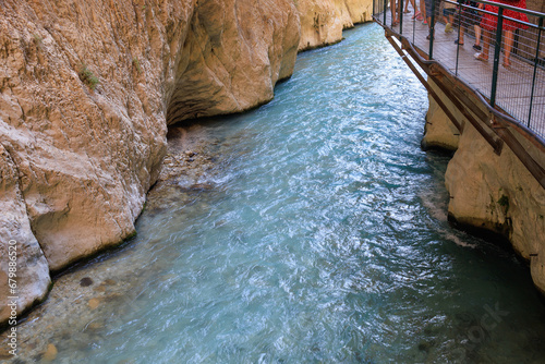 Saklikent Canyon in Turkey with mountain cold stormy water in the river. Natural attraction, popular place for tourists photo