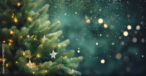 Christmas tree with golden lights and snowflakes on bokeh background. photo
